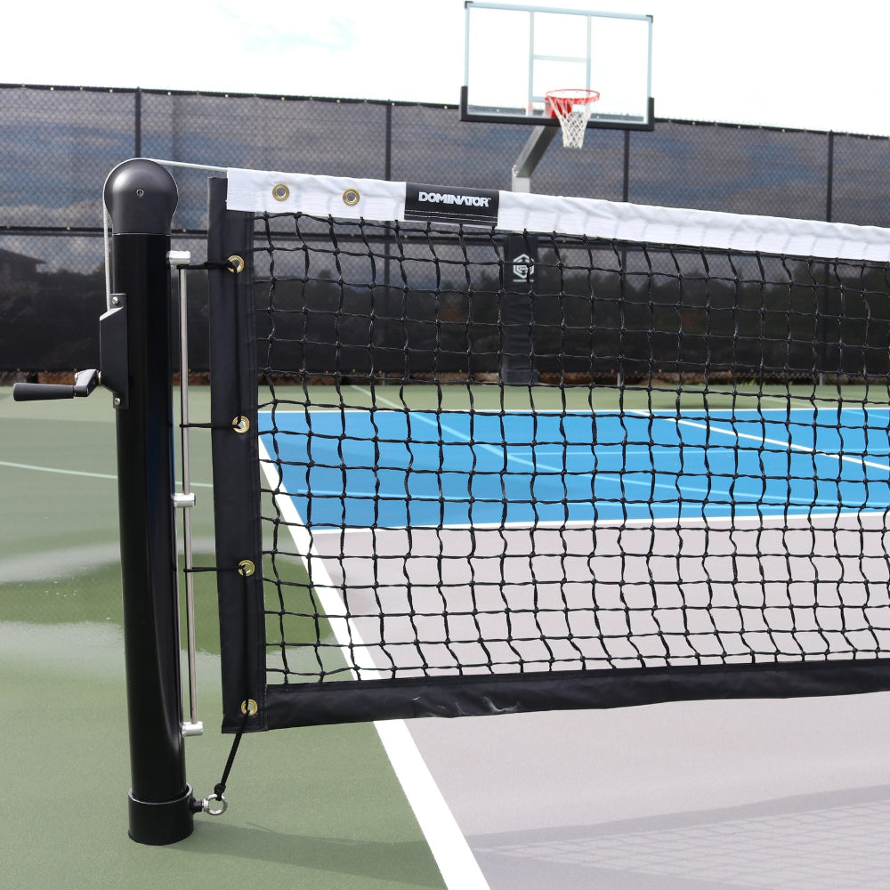 Dominator heavy-duty pickleball net installed on an outdoor court